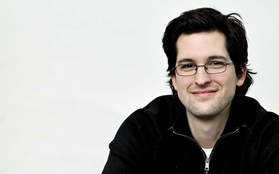 Francis cayoutte black shirt glasses smiling white background 